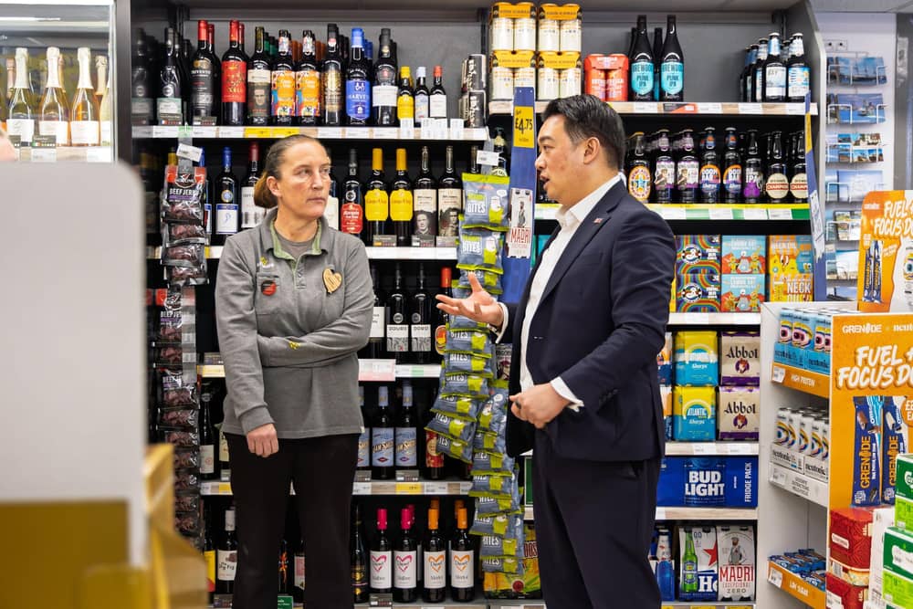 Alan Mak MP talks to a member of the team at Morrisons Daily on Hayling