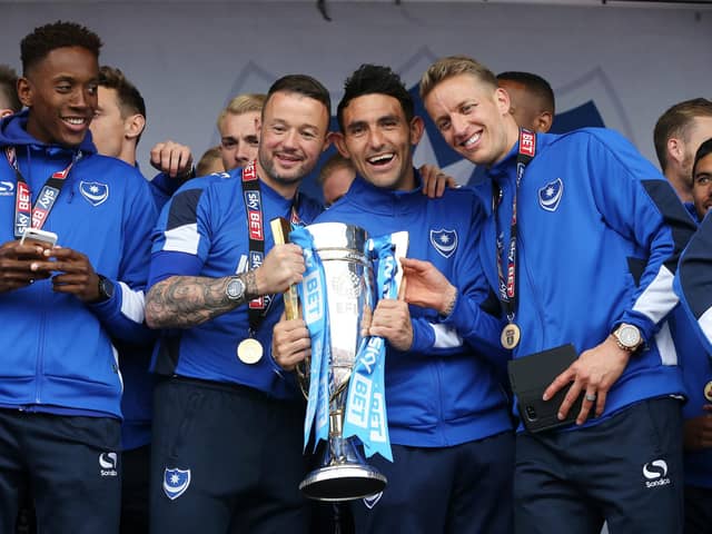 Gary Roberts (second left) celebrates with Pompey team-mates after winning the League Two title in May 2017. Picture: Joe Pepler