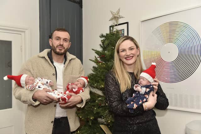Chris Wise with his partner Hannah Gurney and their triplets back home after 35 days at QA. Picture: Sarah Standing (141223-3589)