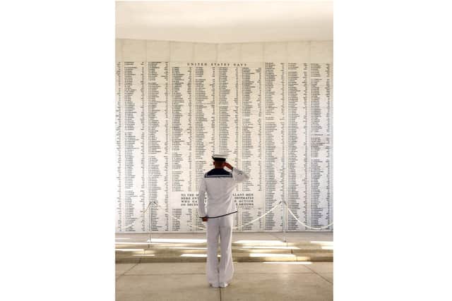 AB Sean 'Buster' Brown salutes the men of the USS Arizona.