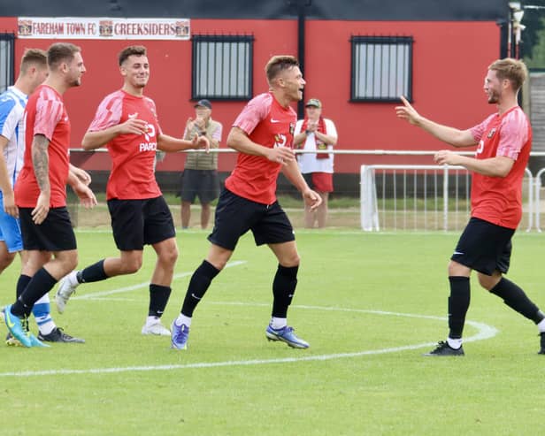 Josh Benfield has just netted one of his two first-half goals for Fareham against Cowes. Picture by Ken Walker