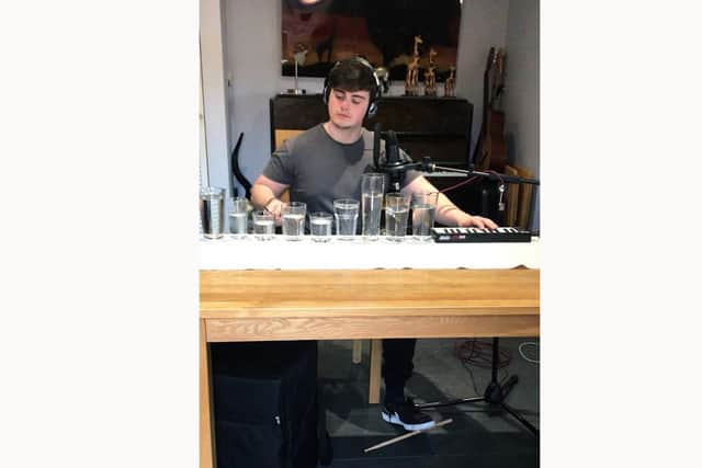Finli Draper, 20, has won an online competition with his viral music videos - and has used his winnings to support a local food bank.