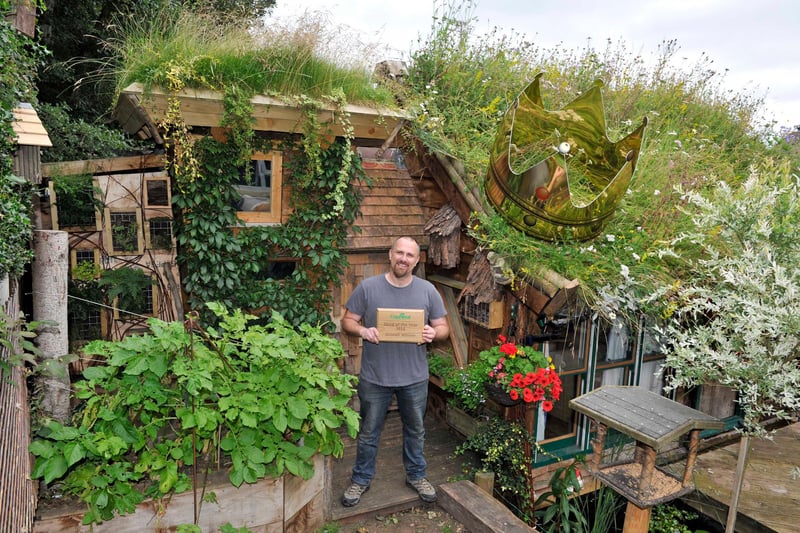 The 2016 winner - built by Kevin Herbert
It is in three sections - the largest part is for me.  It has a bed in loft space and an area to relax and escape my four kids(love them really)second part is through secret bookcase for my ten and 11 year olds to sleep and play and the last part is for storage and workshop.
My shed is made from 90% recycled materials ,It is a project that has taken me 8 years to build(health reasons - won't bore you)the roof is wild turf but because of angle I used 400 milk cartons cut in half - which took a year to collect -popped holes in and layered bottom with shingle for drainage. The two tonnes of soil and turf plopped on top.My kids helped me a lot good fun .A man needs a shed.