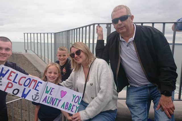 Jack Jukes and Laura Baker alongside the rest of the family. They were waiting at The Round Tower to see Abbey Bissell, who is deployed on HMS Prince of Wales