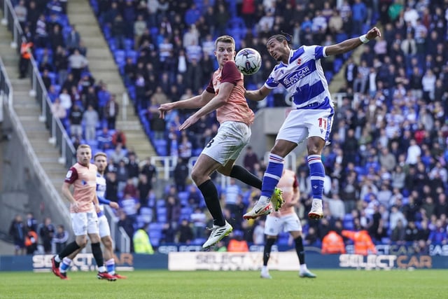 Pompey defender Conor Shaughnessy and Reading midfielder Femi Azeez compete for the ball