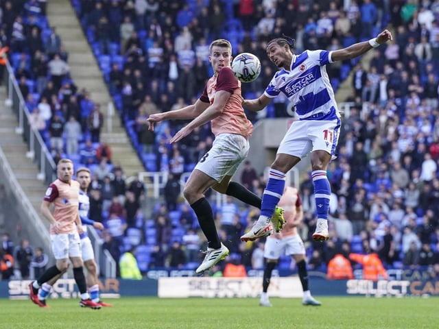 Pompey defender Conor Shaughnessy and Reading midfielder Femi Azeez compete for the ball