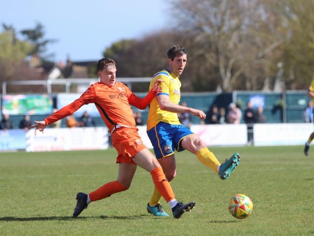 Gosport's Danny Hollands in action against Hartley Wintney. Picture by Tom Phillips