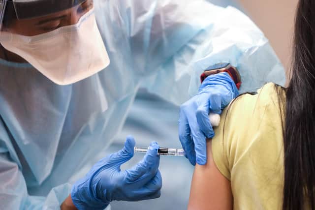 A vaccine being given in a picture posed by models Picture: Mario Tama/Getty Images