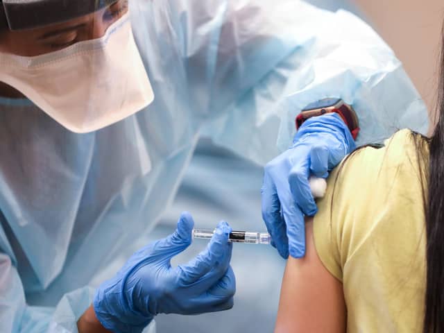 A vaccine being given in a picture posed by models Picture: Mario Tama/Getty Images