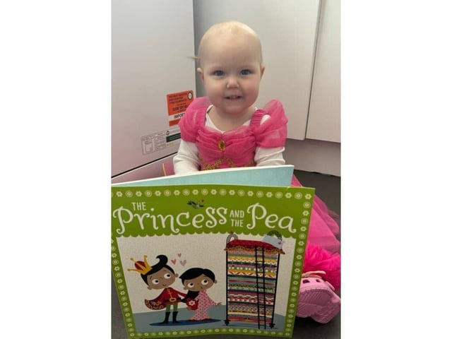 This little princess looks adorable in her fancy dress!