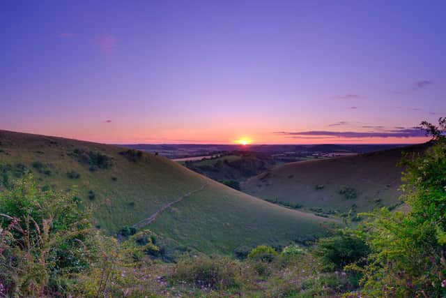 Glorious Hampshire countryside. Clanfield  - July 28, 2020:  Summer sunset over the South Downs from Butser Hill near Petersfield.