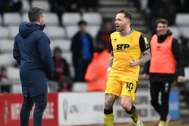 Ex-Pompey striker Chris Maguire celebrates in Lee Johnson's face last night. (Photo by Stu Forster/Getty Images)