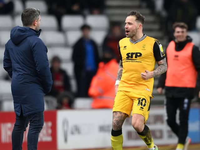 Ex-Pompey striker Chris Maguire celebrates in Lee Johnson's face last night. (Photo by Stu Forster/Getty Images)