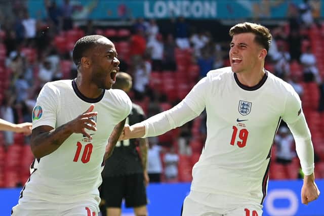 Mason Mount rushes to congratulate Raheem Sterling following his match-winner against Croatia. Picture: Glyn Kirk/AFP via Getty Images