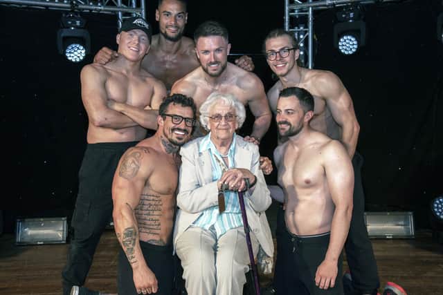 Betty Richardson, 92, who lives at Care UK's Sway Place in Sway, Hampshire, with the current cast of Dreamboys Picture: Penny Plimmer/Care UK/PA Wire