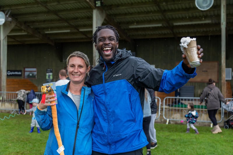 Pictured: Emily McDonald (39) with 'Preacher the Storyteller' in high spirits despite the rain at the Wave Music Festival.
 Picture: Mike Cooter (050823)
