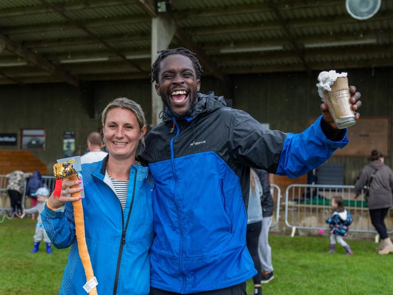 Pictured: Emily McDonald (39) with 'Preacher the Storyteller' in high spirits despite the rain at the Wave Music Festival.
Picture: Mike Cooter (050823)