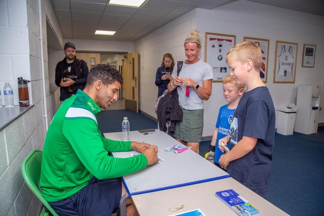 David James at Bay House School, Gosport signing his picture for this young fan