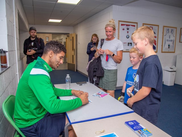 David James at Bay House School, Gosport signing his picture for this young fan