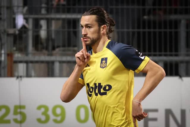 Christian Burgess celebrates scoring Royale Union Saint-Gilloise's opening goal in their 3-0 win against Sporting Charleroi on Saturday. Picture: VIRGINIE LEFOUR/BELGA MAG/AFP via Getty Images