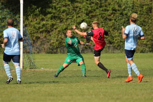 Wymering (red) v Portchester Rovers. Picture: Kevin Shipp