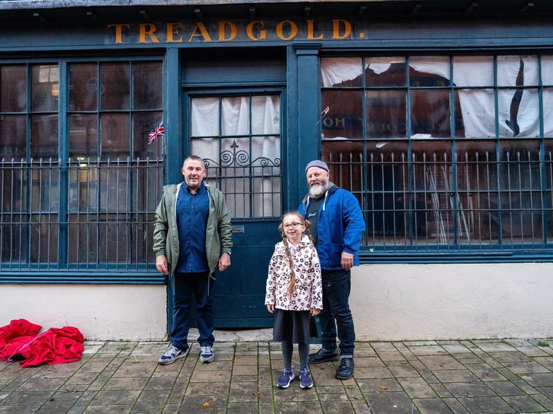 Richard Sexton, Nevaeh Mehmet (6), Pete Codling at the unveiling of the restored 'lion of Portsea'. Photo by Matt Clark