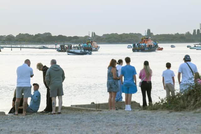 Around 140 migrants arrive in Portsmouth after being transferred from a single dingy south of the Isle of Wight in the English Channel by two RNLI lifeboats