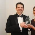 Stewart Woolston of the Chilli Mash Company in Hilsea, winner of Small Business of the Year in 2019, with Professor Martina Battisti from category sponsor the University of Portsmouth Business School