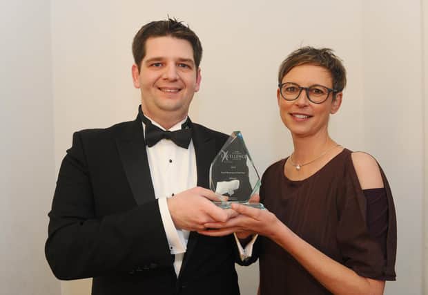 Stewart Woolston of the Chilli Mash Company in Hilsea, winner of Small Business of the Year in 2019, with Professor Martina Battisti from category sponsor the University of Portsmouth Business School
