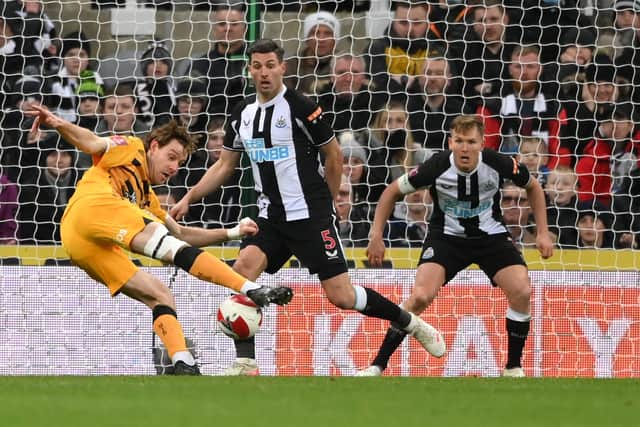 Cambridge striker Joe Ironside scores his side's winning goal at Newcastle. Photo by Stu Forster/Getty Images.
