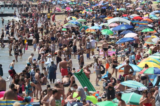 Crowds gather on the beach in Bournemouth. Picture: Andrew Matthews/PA Wire