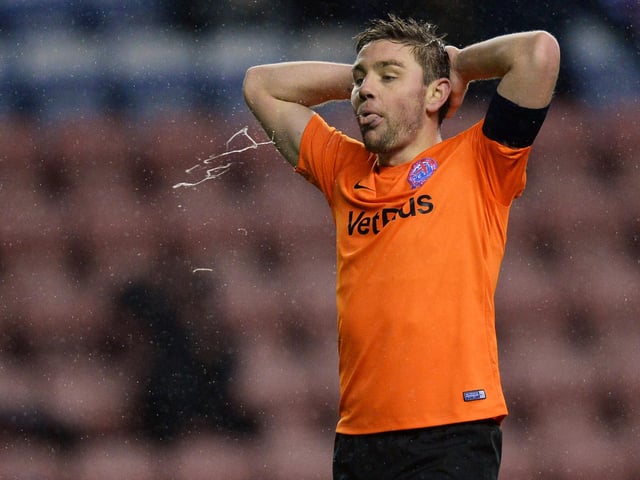 The midfielder has joined Fleetwood on a one-year deal. He is currently serving a 10-match ban for using abusive language towards Rochdale defender Paul McShane during a game in January. Picture: Nathan Stirk/Getty Images