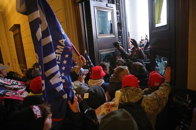 Protesters supporting US President Donald Trump break into the US Capitol on January 6, 2021 in Washington, DC. Photo by Win McNamee/Getty Images