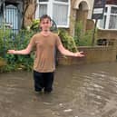 Residents of Salisbury Road in Cosham are calling for urgent action after flooding has hit their street. Jonah Ford stands in the flood. Picture: Lucy Heard
