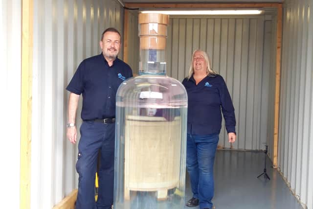 Russ and Michelle with the 1.8m record breaking whiskey bottle