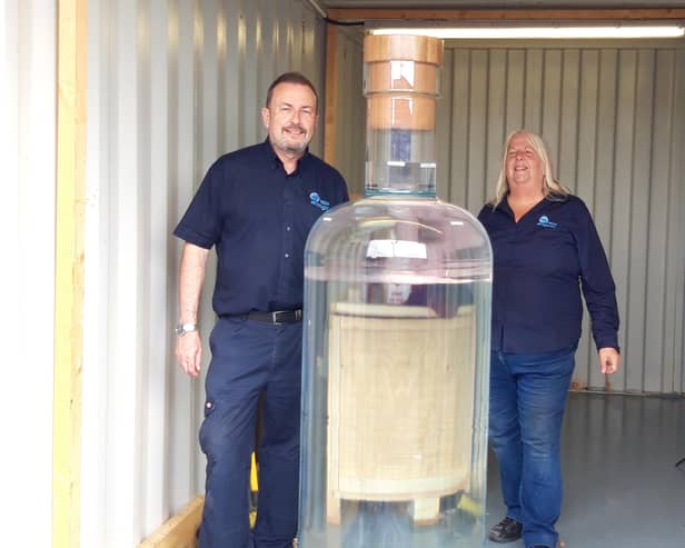 Russ and Michelle with the 1.8m record breaking whiskey bottle