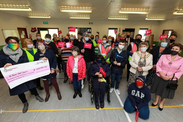 Cheque presentation to The Friday Night Charity by Lucy Tennant, left, from the National Lottery Community Fund. Pictured at the 10th Fareham Scout Hall, Highlands Rd, Fareham
Picture: Chris Moorhouse (jpns 240521-07)