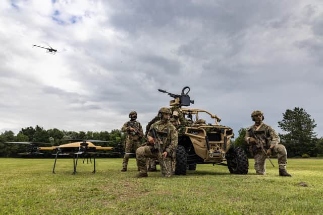Pictured are Royal Marines of 40 Commando with the Ghost drone during a demonstration for the First Sea Lord