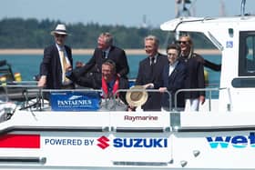 Geoff Holt MBE welcomes HRH Princess Royal and invited guests onto a Wetwheels accessible powerboat.