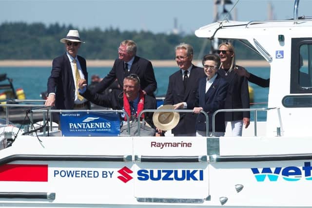 Geoff Holt MBE welcomes HRH Princess Royal and invited guests onto a Wetwheels accessible powerboat.