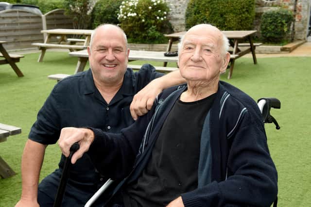 Albert Green known as "Jimmy" from Drayton, turned 100 on Saturday, October 1, and celebrated with his son Peter Green and his friends from the United Reformed Church coffee club, at The Sunshine Inn pub in Drayton.Pictured is: Jimmy Green with his son Peter Green (66).Picture: Sarah Standing (290922-3975)