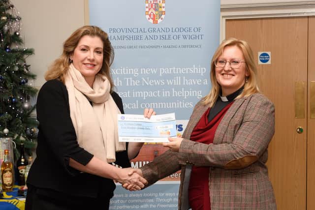 Portsmouth North MP Penny Mordaunt MP presents a cheque to the Rev Amy Webb from the Cosham Larder as part of the Community Chest campaign
Picture: Keith Woodland (041221-29)