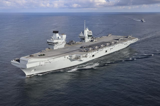 Pictured: HMS Prince of Wales (R09) followed by HMS Portland (F79). Aerial imagery of the UKCSG Task Group taken from a Merlin Mk2 of 814 Naval Air Squadron.
