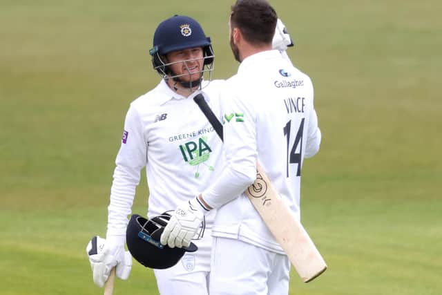 James Vince of Hampshire celebrates reaching the third double century of his career with Liam Dawson. Photo by Alex Pantling/Getty Images.