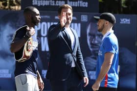 Promoter Eddie Hearn, centre, puts his hand between Mikey McKinson, right, and Chris Kongo. Picture: Mark Robinson/Matchroom Boxing