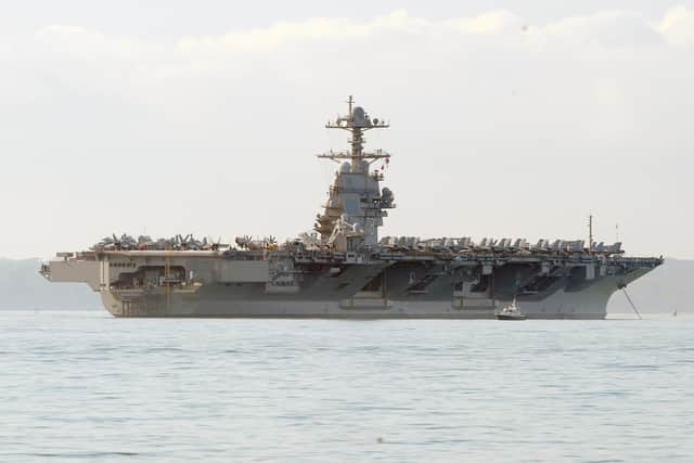 USS Gerald R Ford United States Navy aircraft carrier seen from Stokes Bay, on Monday, November 14.

Picture: Sarah Standing (141122-2732)