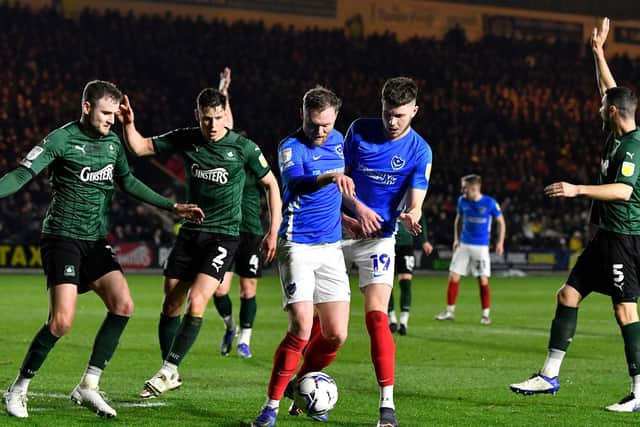 O'Brien and Hirst battle for the ball at Home Park. Picture: Graham Hunt