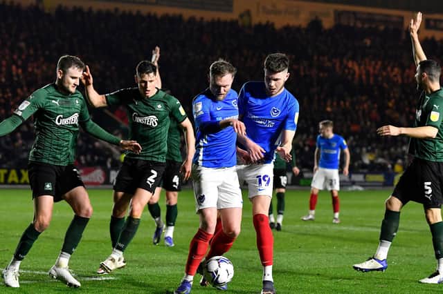 O'Brien and Hirst battle for the ball at Home Park. Picture: Graham Hunt