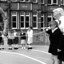 Former MP David Martin joins in playtime with children from Milton Park School. The News PP3773