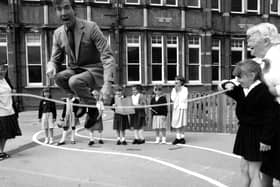 Former MP David Martin joins in playtime with children from Milton Park School. The News PP3773